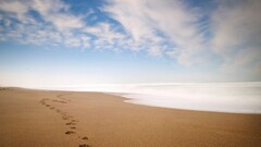 beach sky footprints clouds Sea sand