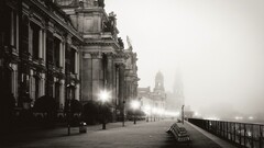 monochrome Dresden cityscape lights mist old building
