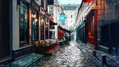 street painting cobblestone Paris lantern chair umbrella
