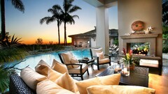 sunset swimming pool palm trees chair