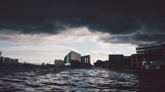 cityscape clouds water overcast waves dark