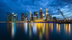 cityscape skyline cranes (machine) skyscraper reflection