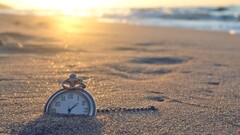 clocks beach sand sunlight