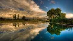 coast sky reflection nature landscape clouds Trees water