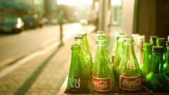 coca-cola bottles urban bokeh