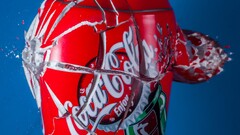 coca-cola red can blue background explosion