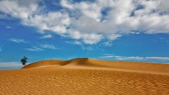 desert landscape dunes sand clouds canary islands