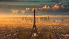 Eiffel Tower sunlight France Paris sky clouds construction