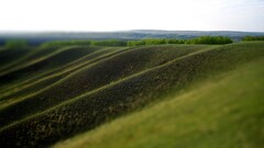 field outdoors tilt-shift hill landscape blurred grass