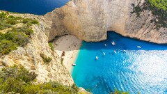 Greece Sea beach cliff rock boat sunlight Turquoise shrubs waves