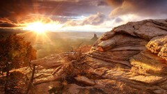 landscape rock sun rays nature sky clouds sunlight