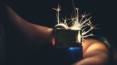 lighter sparks dark