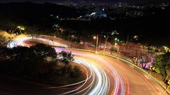 long exposure road hairpin turns night light trails
