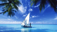 Maldives vehicle Sailboats palm trees water sky clouds
