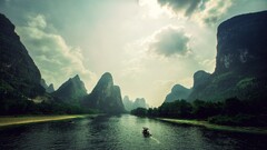 nature Mountains river landscape water boat sky clouds