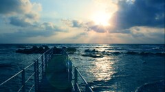 pier sunlight clouds sky Sea