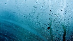 rain water on glass water drops cyan