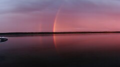 rainbows water sky boat