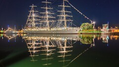sailing ship ship water lights reflection