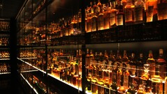 Scotch bottles Shelves alcohol warm colors
