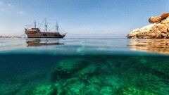 Sea ship rock split-view water underwater