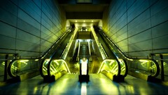 subway symmetry escalator building lights