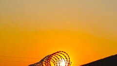 sun sunlight silhouette wall barbed wire