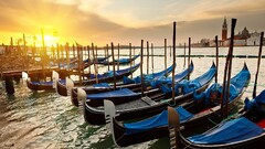 sunset boat venice Italy sunlight gondolas cityscape