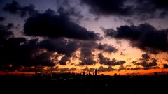 sunset cityscape sunlight clouds