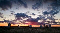 sunset sky clouds stones